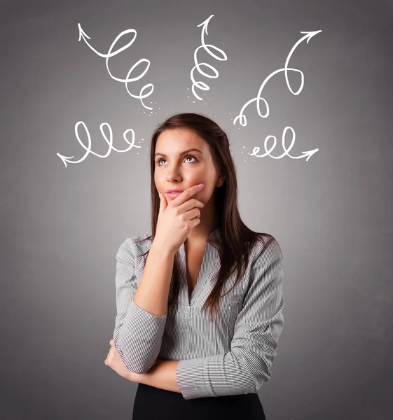 Young woman thinking with arrows overhead — Stock Photo, Image