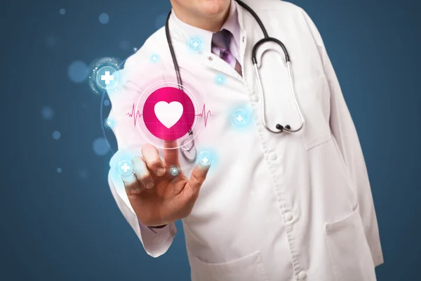 Middle aged doctor pressing modern medical type of button — Stock Photo, Image