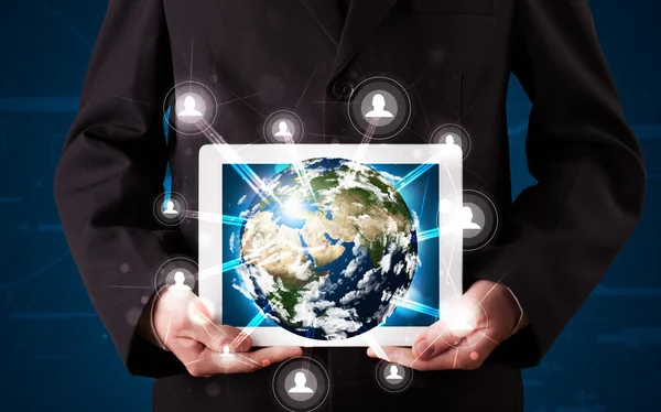 Businessman presenting 3d earth globe in tablet — Stock Photo, Image