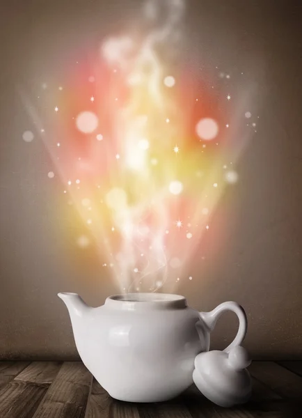 Tea pot with abstract steam and colorful lights — Stock Photo, Image