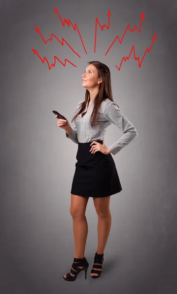 Young woman thinking with arrows overhead — Stock Photo, Image