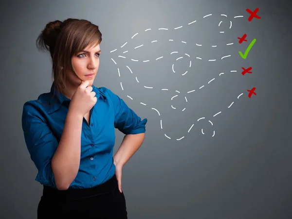 Young woman choosing between right and wrong signs — Stock Photo, Image