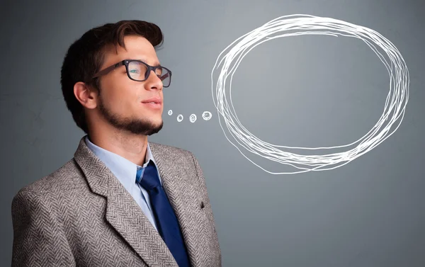 Good-looking man thinking about speech or thought bubble with co — Stock Photo, Image