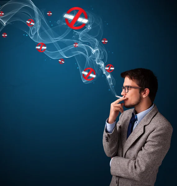 Attraktiver Mann raucht gefährliche Zigarette mit Nichtraucherzeichen — Stockfoto