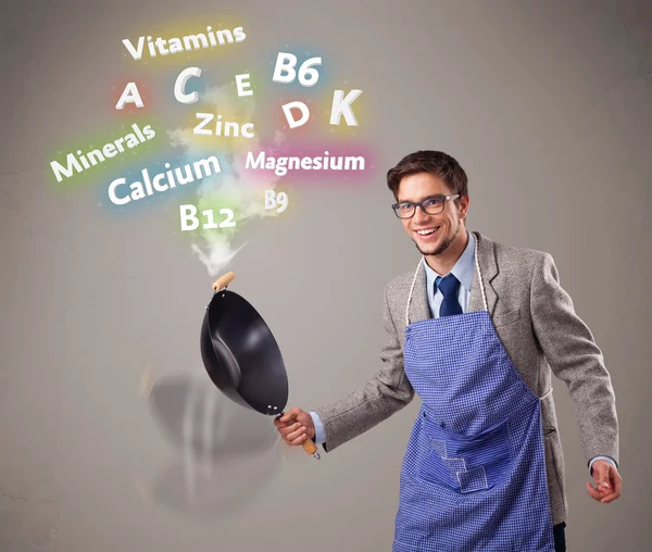 Homem cozinhar vitaminas e minerais — Fotografia de Stock