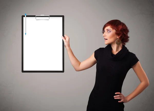 Young girl holding black folder with white sheet copy space — Stock Photo, Image