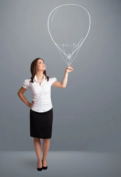 Beautiful woman holding balloon drawing — Stock Photo, Image