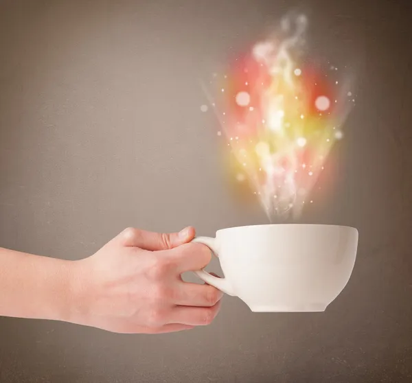 Coffee mug with abstract steam and colorful lights — Stock Photo, Image