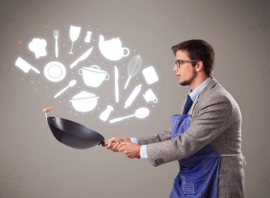 mutfak aksesuarları simgeleri ile yakışıklı adam