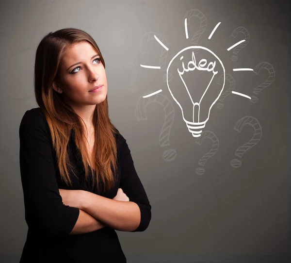 Menina comutando com um sinal de ideia bubl luz — Fotografia de Stock