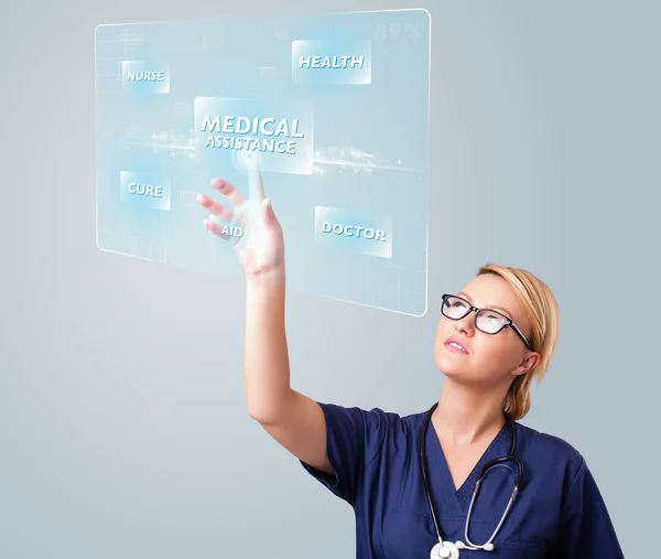 Junge Krankenschwester drückt moderne medizinische Knöpfe — Stockfoto