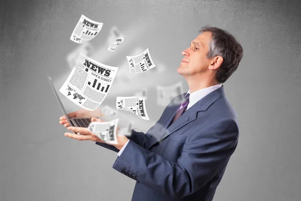 Middle aged businessman holding notebook and reading the explosi — Stock Photo, Image