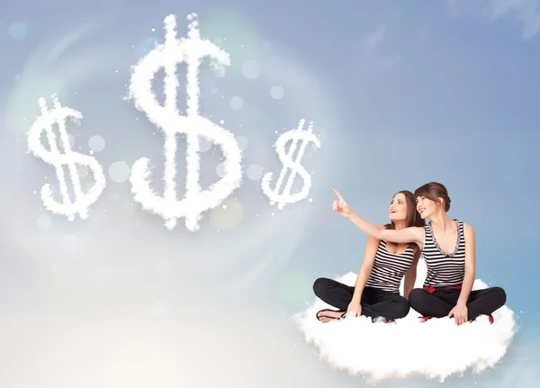 Young women sitting on cloud next to cloud dollar signs — Stock Photo, Image