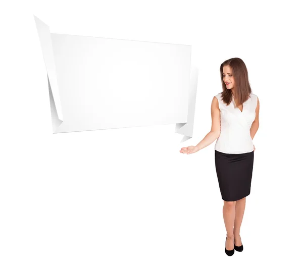 Young woman presenting abstract origami copy space — Stock Photo, Image