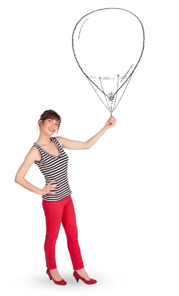 Pretty woman holding balloon drawing — Stock Photo, Image