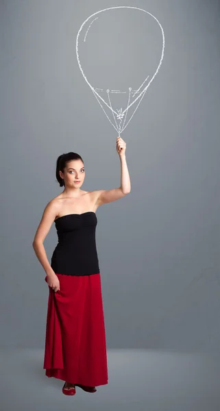 Mulher bonita segurando desenho de balão — Fotografia de Stock