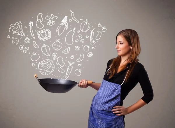 Woman cooking vegetables — Stock Photo, Image