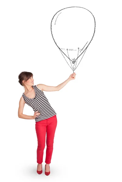 Pretty woman holding balloon drawing — Stock Photo, Image