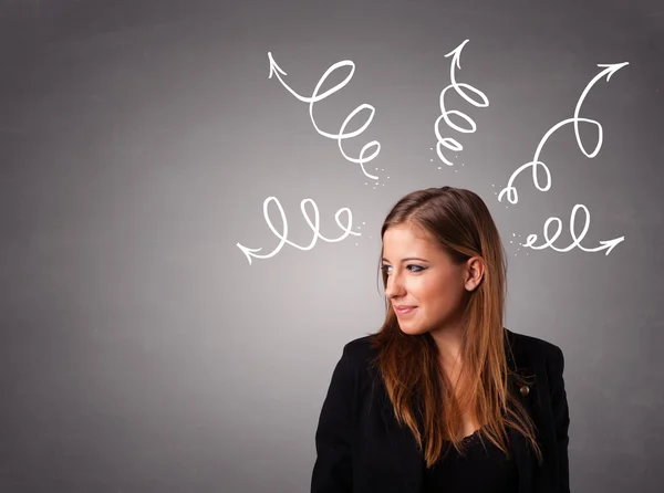 Young woman thinking with arrows overhead — Stock Photo, Image