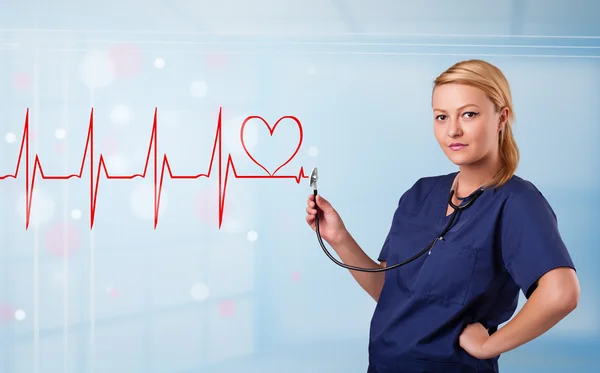 Junge Krankenschwester hört abstrakten Puls mit rotem Herz — Stockfoto