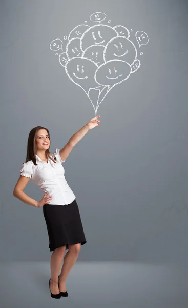 Mulher feliz segurando sorrindo balões desenho — Fotografia de Stock