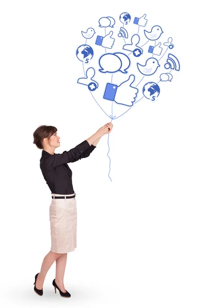 Happy lady holding social icon balloon — Stock Photo, Image