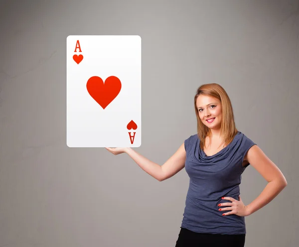 Beautifu woman holding a red heart ace — Stock Photo, Image