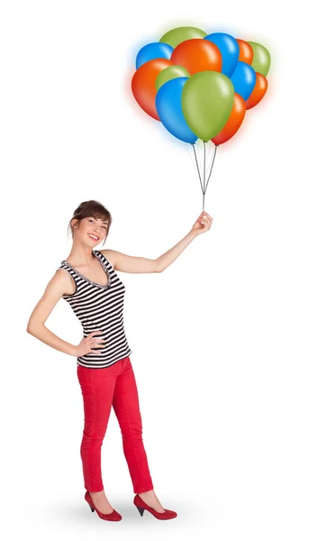 Mujer joven sosteniendo globos de colores —  Fotos de Stock