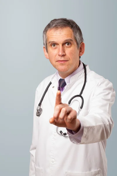Middle aged doctor gesturing with copy space — Stock Photo, Image