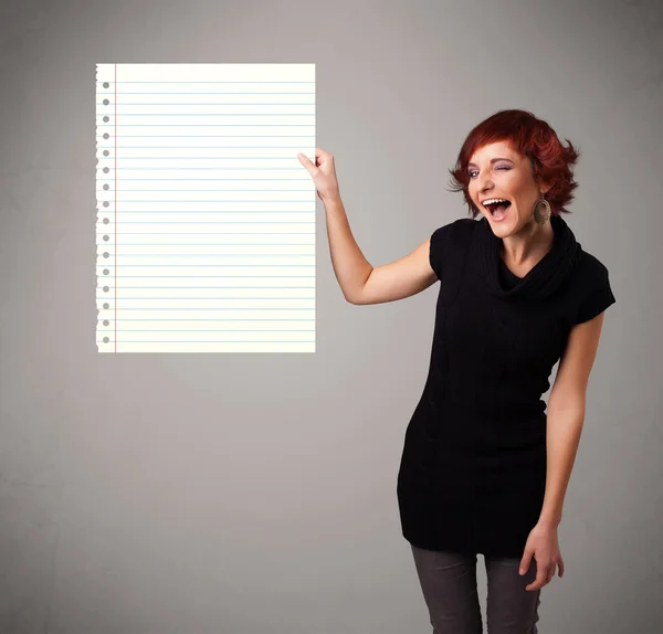 Young woman holding white paper copy space with diagonal lines — Stock Photo, Image