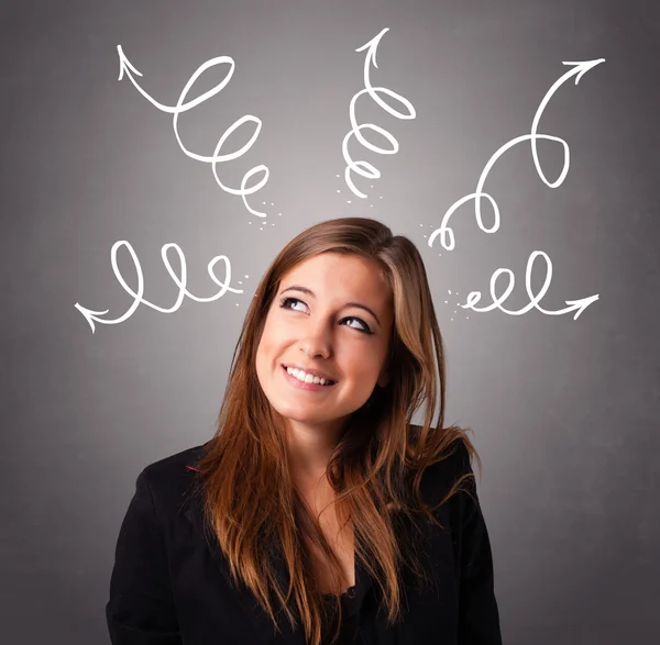 Young woman thinking with arrows overhead — Stock Photo, Image