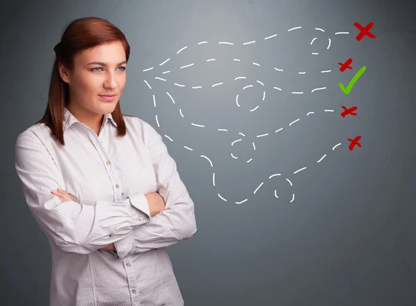 Mujer joven eligiendo entre signos correctos e incorrectos —  Fotos de Stock