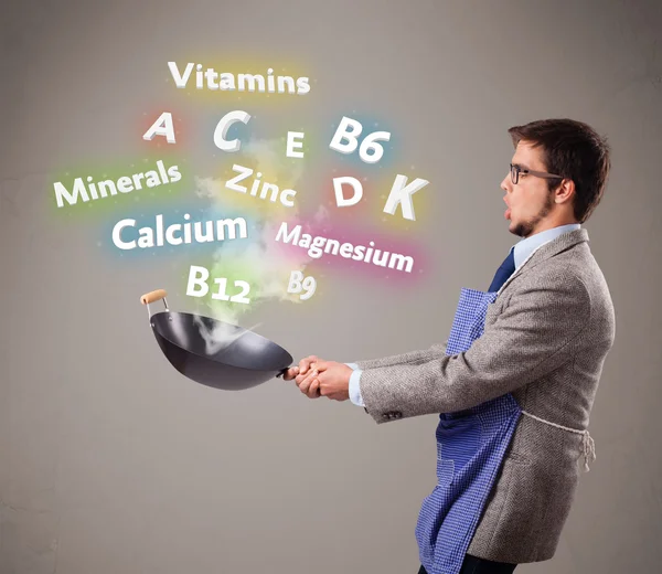 Man cooking vitamins and minerals — Stock Photo, Image