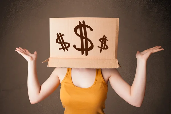 Young girl gesturing with a cardboard box on his head with dolla — Stock Photo, Image