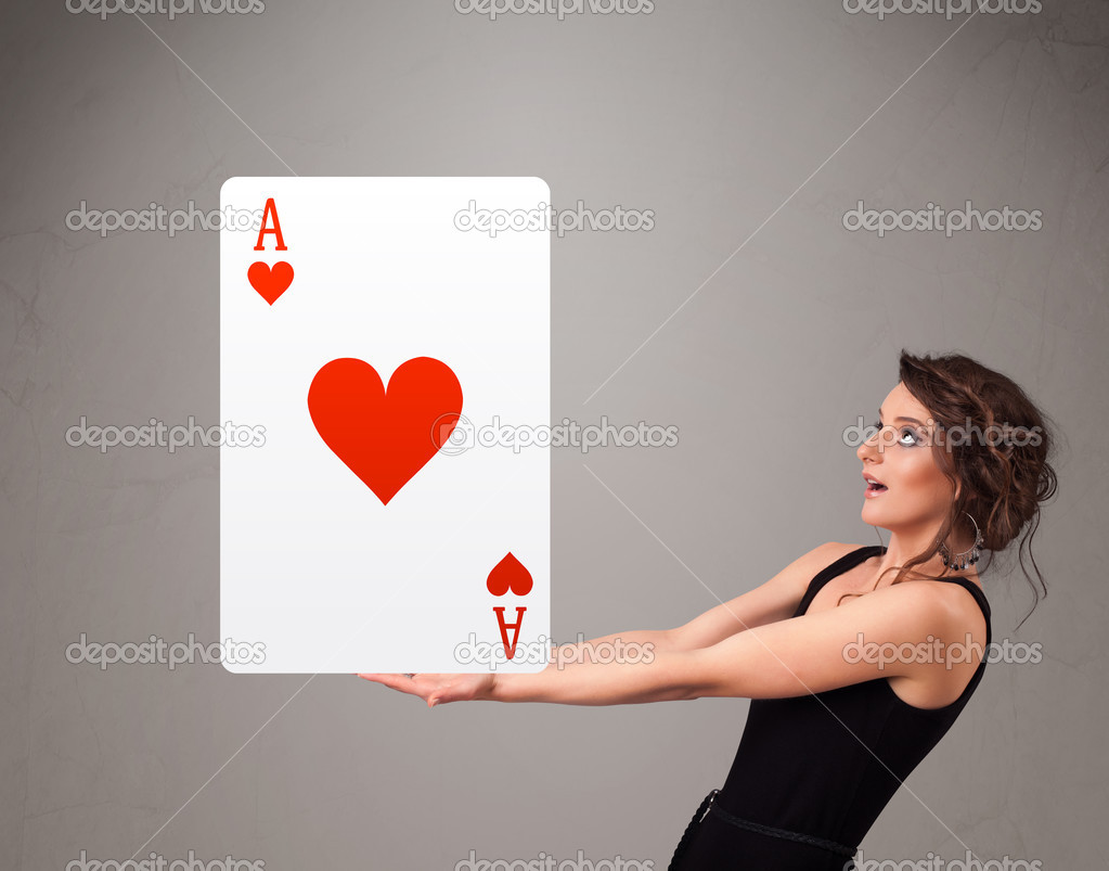 Beautifu woman holding a red heart ace