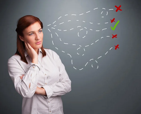 Young woman choosing between right and wrong signs — Stock Photo, Image