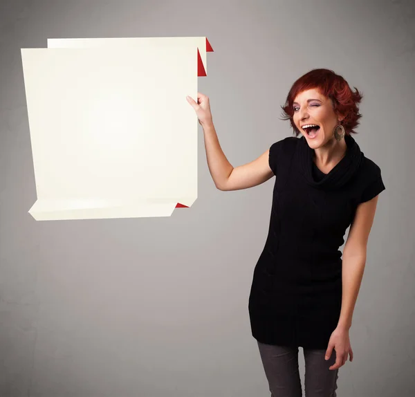 Young woman holding white origami paper copy space — Stock Photo, Image