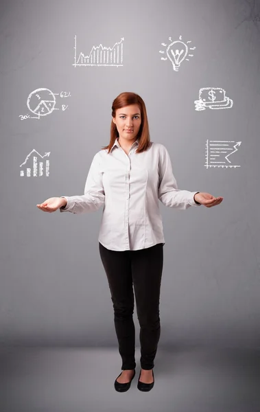 Beautiful young woman juggling with statistics and graphs — Stock Photo, Image