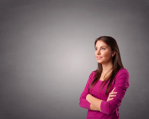 Young woman standing and thinking with copy space — Stock Photo, Image