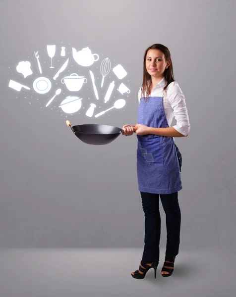 Jovem com ícones de acessórios de cozinha — Fotografia de Stock