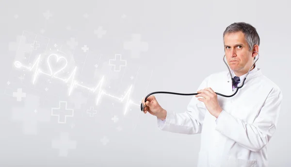 Doctor examinates heartbeat with abstract heart — Stock Photo, Image