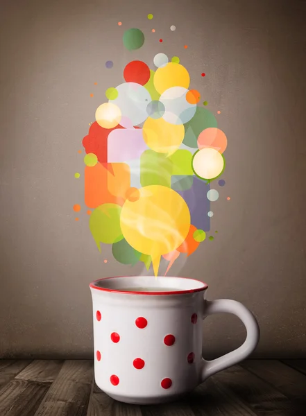 Tea cup with colorful speech bubbles — Stock Photo, Image