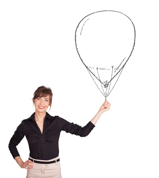 Pretty woman holding balloon drawing — Stock Photo, Image