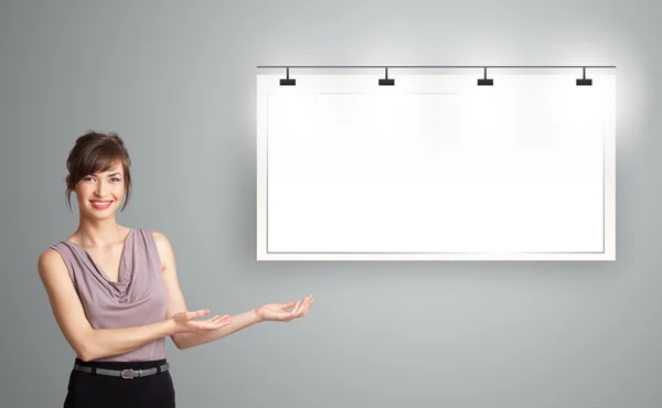 Young woman presenting modern copy space — Stock Photo, Image