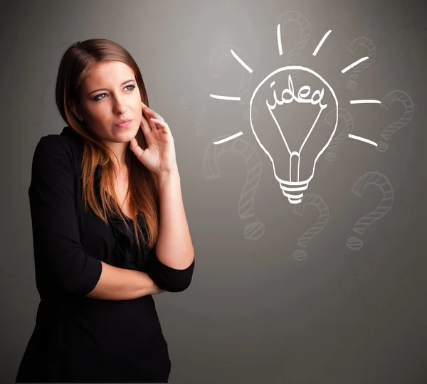 Young girl comming up with a light bubl idea sign — Stock Photo, Image