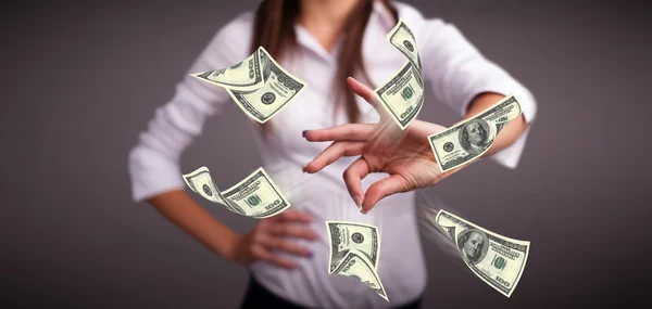 Young girl throwing money — Stock Photo, Image