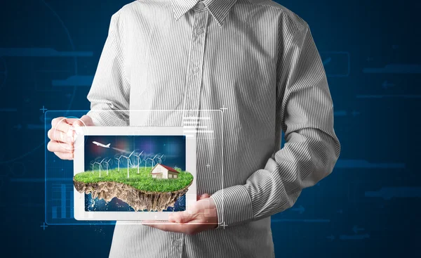 Businessman presenting a perfect ecology land with a house and w — Stock Photo, Image