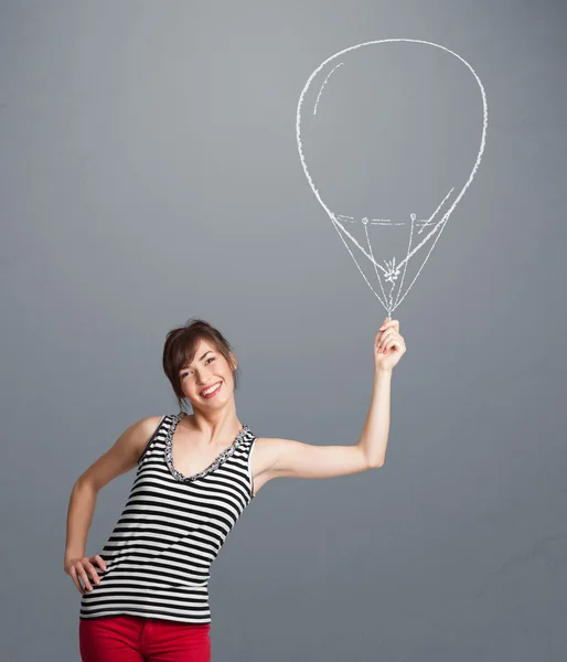 Hermosa mujer sosteniendo el dibujo del globo —  Fotos de Stock