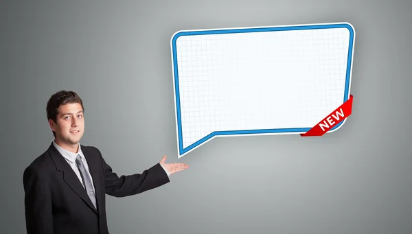 Young man presenting modern speech bubble copy space — Stock Photo, Image