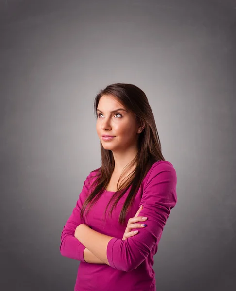 Young woman standing and thinking with copy space — Stock Photo, Image